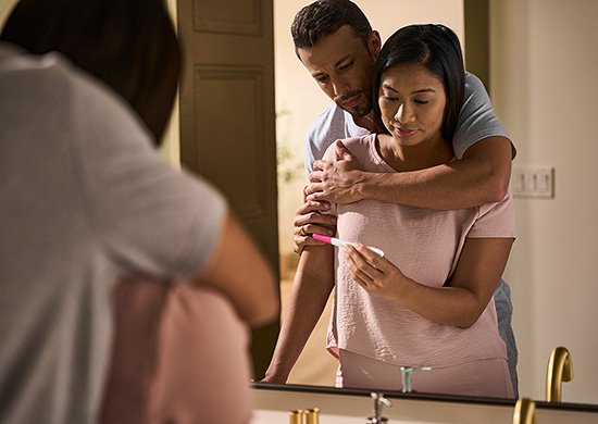 Couple waiting for pregnancy test results.